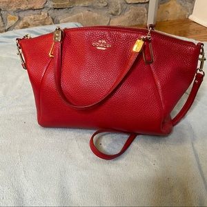 Red coach bag with gold hardware